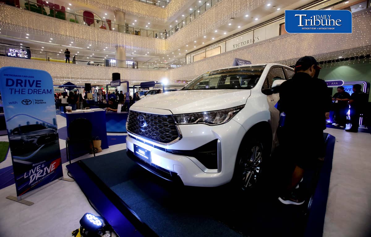 Car enthusiasts visit the two-day Metrobank Live and Drive Home and Car Loan event at SM Megamall on Saturday, 12 September. The event, which runs until Sunday, features hybrid vehicles, residential developments and solar solutions. | Analy Labor