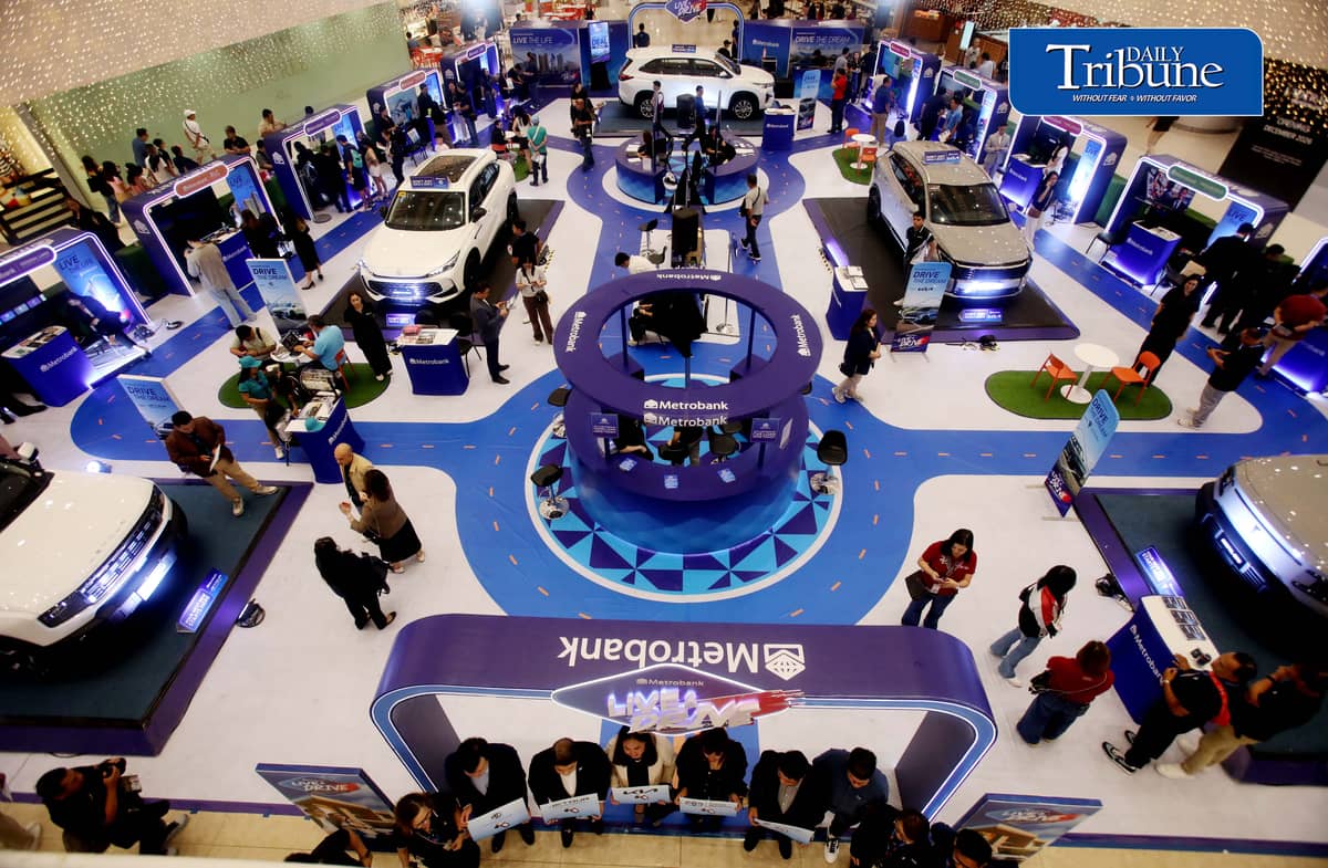 Car enthusiasts visit the two-day Metrobank Live and Drive Home and Car Loan event at SM Megamall on Saturday, 12 September. The event, which runs until Sunday, features hybrid vehicles, residential developments and solar solutions. | Analy Labor