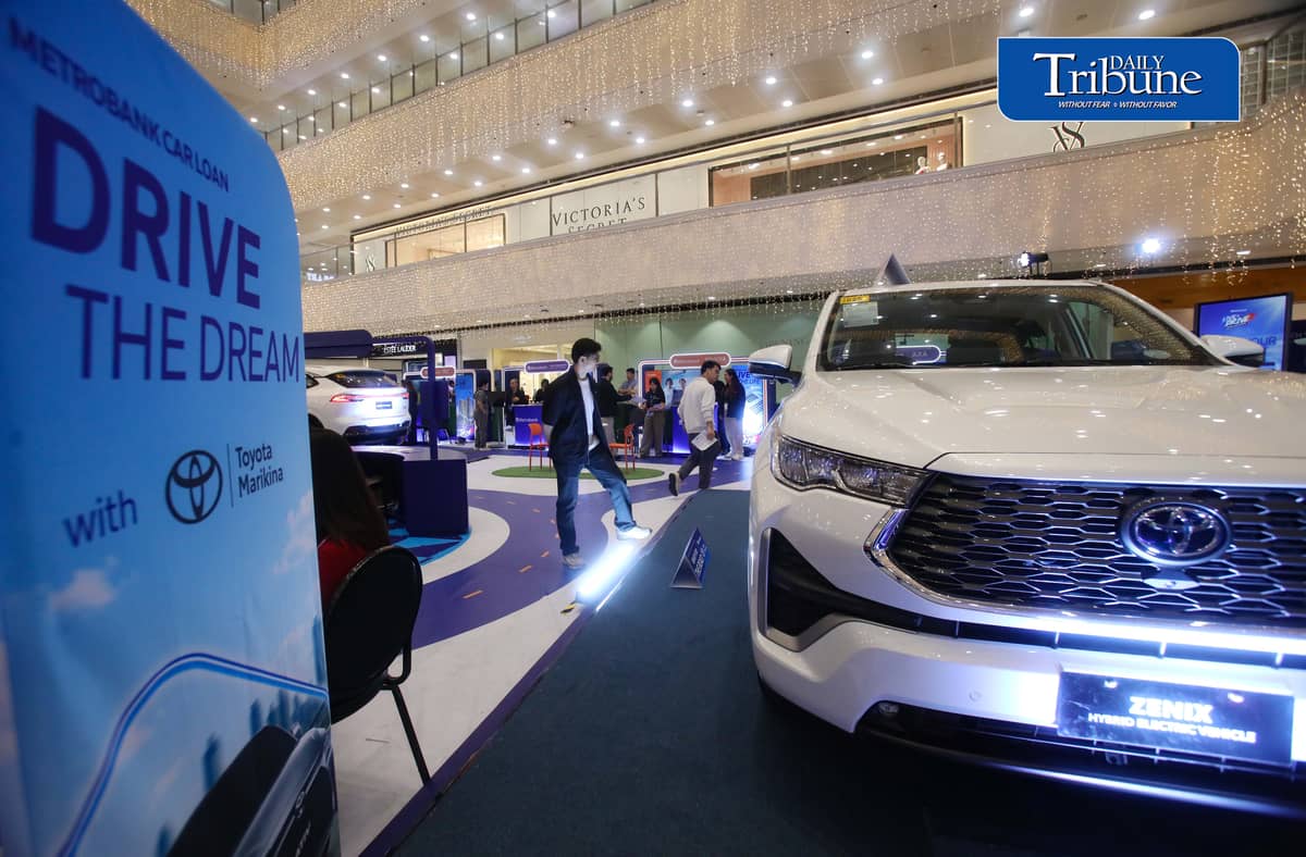 Car enthusiasts visit the two-day Metrobank Live and Drive Home and Car Loan event at SM Megamall on Saturday, 12 September. The event, which runs until Sunday, features hybrid vehicles, residential developments and solar solutions. | Analy Labor