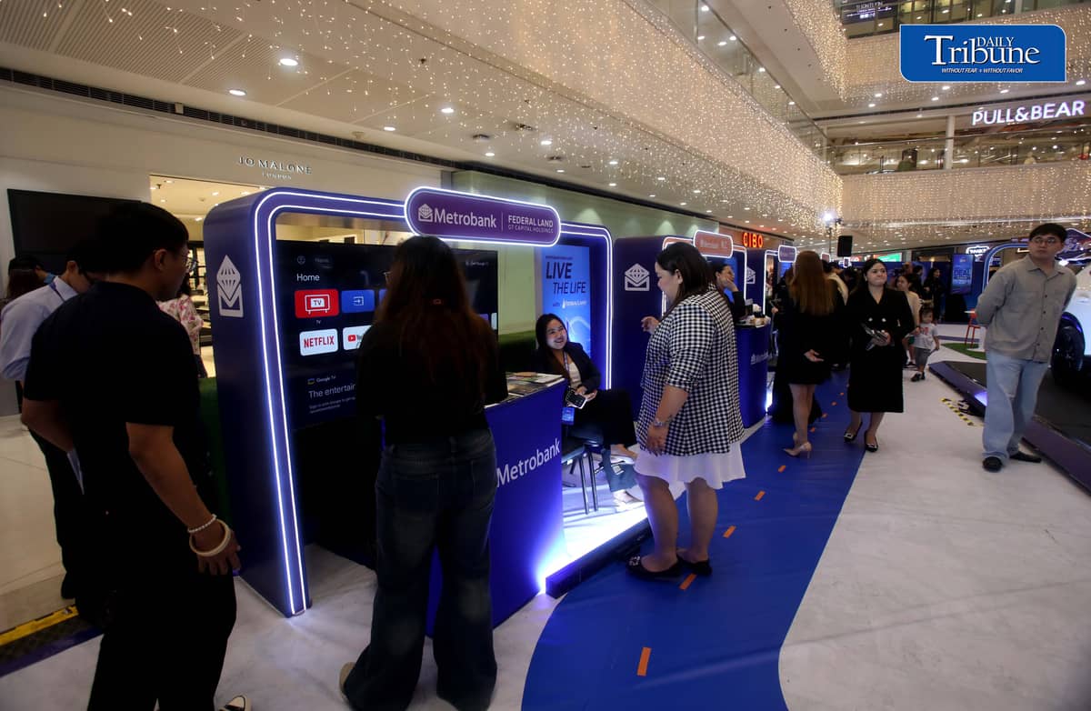 Car enthusiasts visit the two-day Metrobank Live and Drive Home and Car Loan event at SM Megamall on Saturday, 12 September. The event, which runs until Sunday, features hybrid vehicles, residential developments and solar solutions. | Analy Labor