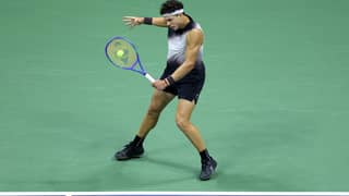 NEW YORK, NEW YORK - SEPTEMBER 11: Ben Shelton of the United States returns a shot against Frances Tiafoe of the United States during their Men's Semifinal match on Day Thirteen of the 2026 US Open at USTA Billie Jean King National Tennis Center on September 11, 2026 in the Flushing neighborhood of the Queens borough of New York City.