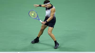 NEW YORK, NEW YORK - SEPTEMBER 11: Ben Shelton of the United States returns a shot against Frances Tiafoe of the United States during their Men's Semifinal match on Day Thirteen of the 2026 US Open at USTA Billie Jean King National Tennis Center on September 11, 2026 in the Flushing neighborhood of the Queens borough of New York City.