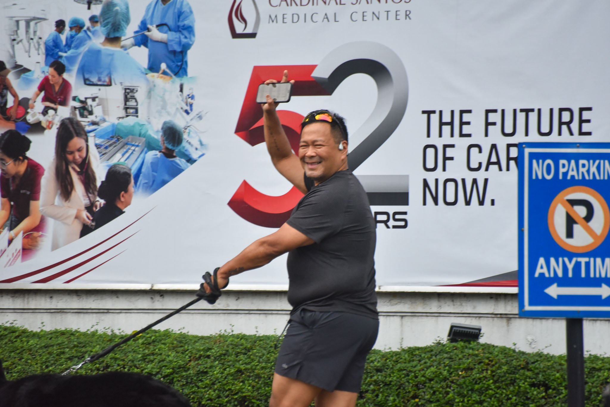 Senator JV. Ejercito walks his dog outside the Cardinal Santos Medical Center