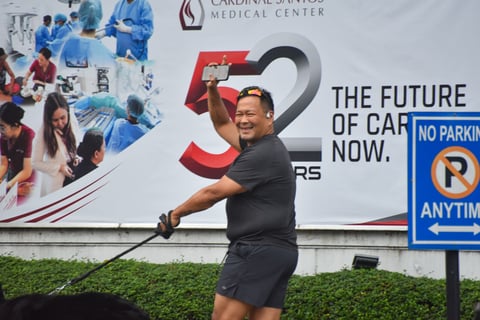 Senator JV. Ejercito walks his dog outside the Cardinal Santos Medical Center