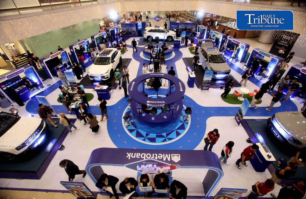 Car enthusiasts visit the two-day Metrobank Live and Drive Home and Car Loan event at SM Megamall on Saturday, 12 September. The event, which runs until Sunday, features hybrid vehicles, residential developments and solar solutions. | Analy Labor