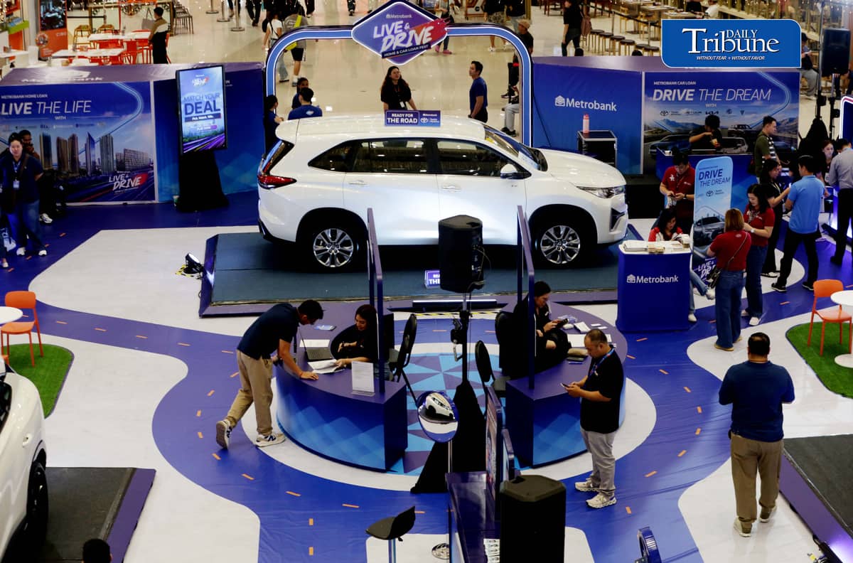 Car enthusiasts visit the two-day Metrobank Live and Drive Home and Car Loan event at SM Megamall on Saturday, 12 September. The event, which runs until Sunday, features hybrid vehicles, residential developments and solar solutions. | Analy Labor