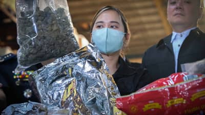 BUREAU of Customs and Philippine Drug Enforcement Agency officers stand guard near intercepted packages containing more than P199.7 million worth of methamphetamine and high-grade marijuana at a warehouse in Pasay.