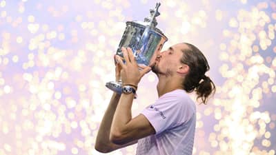 Germany's Alexander Zverev kisses the trophy after defeating USA's Ben Shelton in the men's singles final tennis match on day fifteen of the US Open tennis tournament at the USTA Billie Jean King National Tennis Center in New York on September 13, 2026.