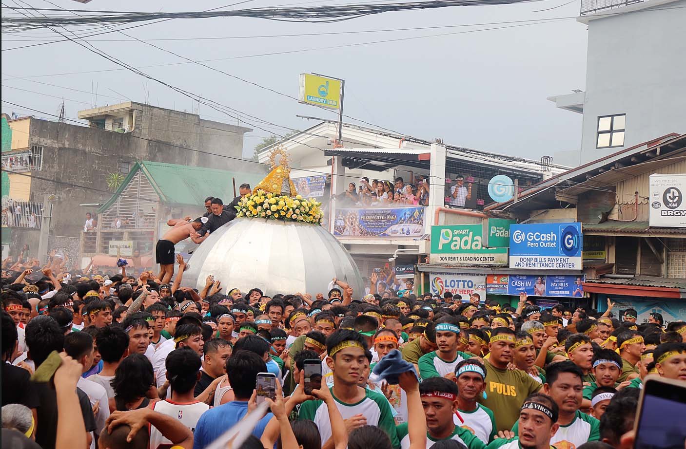 ANDAS carrying Our Lady of Peñafrancia moving through crowds during the Traslacion procession.