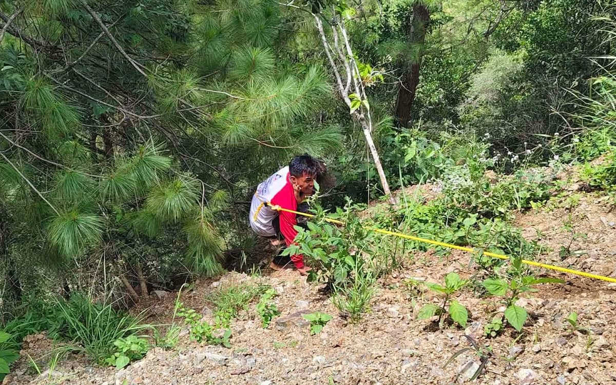 RESCUE teams conduct operations after an Elf vehicle carrying around 27 passengers fell an estimated 50 to 100 meters down a slope along the Talubin-Barlig Road in Sitio Jakap, Talubin, Bontoc, on Tuesday.