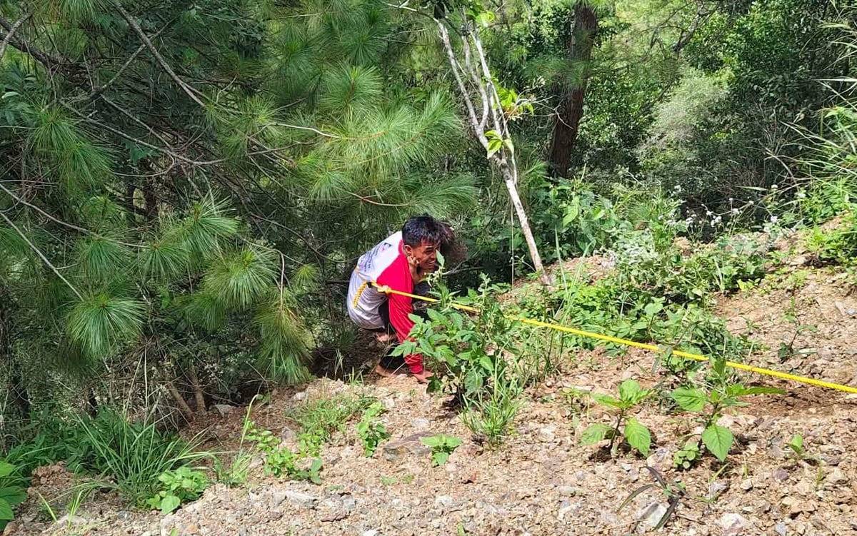 RESCUE teams conduct operations after an Elf vehicle carrying around 27 passengers fell an estimated 50 to 100 meters down a slope along the Talubin-Barlig Road in Sitio Jakap, Talubin, Bontoc, on Tuesday.