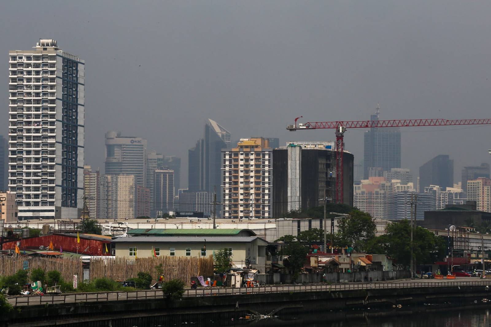 Haze shrouds high-rise buildings in Metro Manila, as seen from JW Diokno Boulevard in Pasay City on 17 September 2026. The Metro Manila air quality index ranged from moderate to unhealthy, according to the IQAir app.