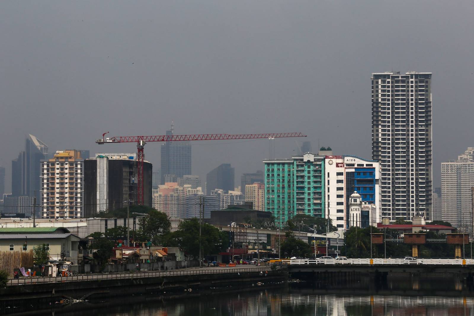 Haze shrouds high-rise buildings in Metro Manila, as seen from JW Diokno Boulevard in Pasay City on 17 September 2026. The Metro Manila air quality index ranged from moderate to unhealthy, according to the IQAir app.