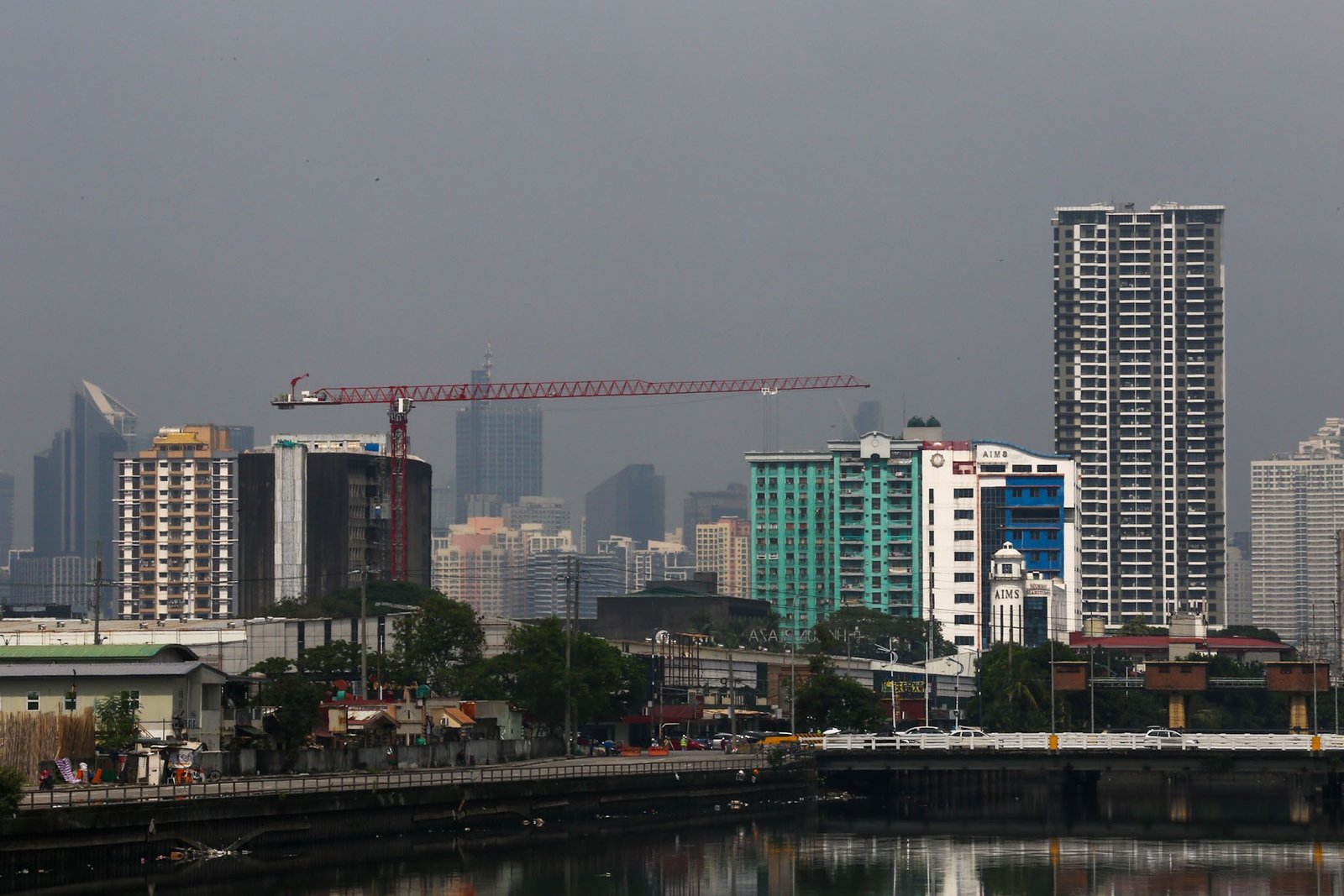 Haze shrouds high-rise buildings in Metro Manila, as seen from JW Diokno Boulevard in Pasay City on 17 September 2026. The Metro Manila air quality index ranged from moderate to unhealthy, according to the IQAir app.