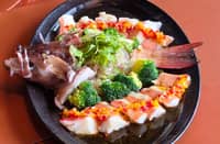 STEAMED grouper with homemade yellow bell pepper sauce.