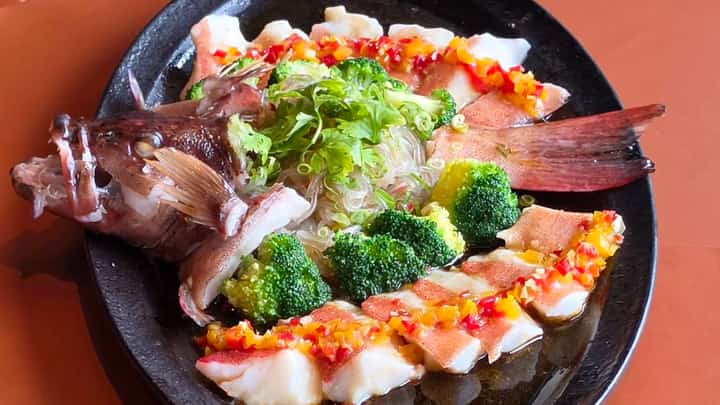 STEAMED grouper with homemade yellow bell pepper sauce.