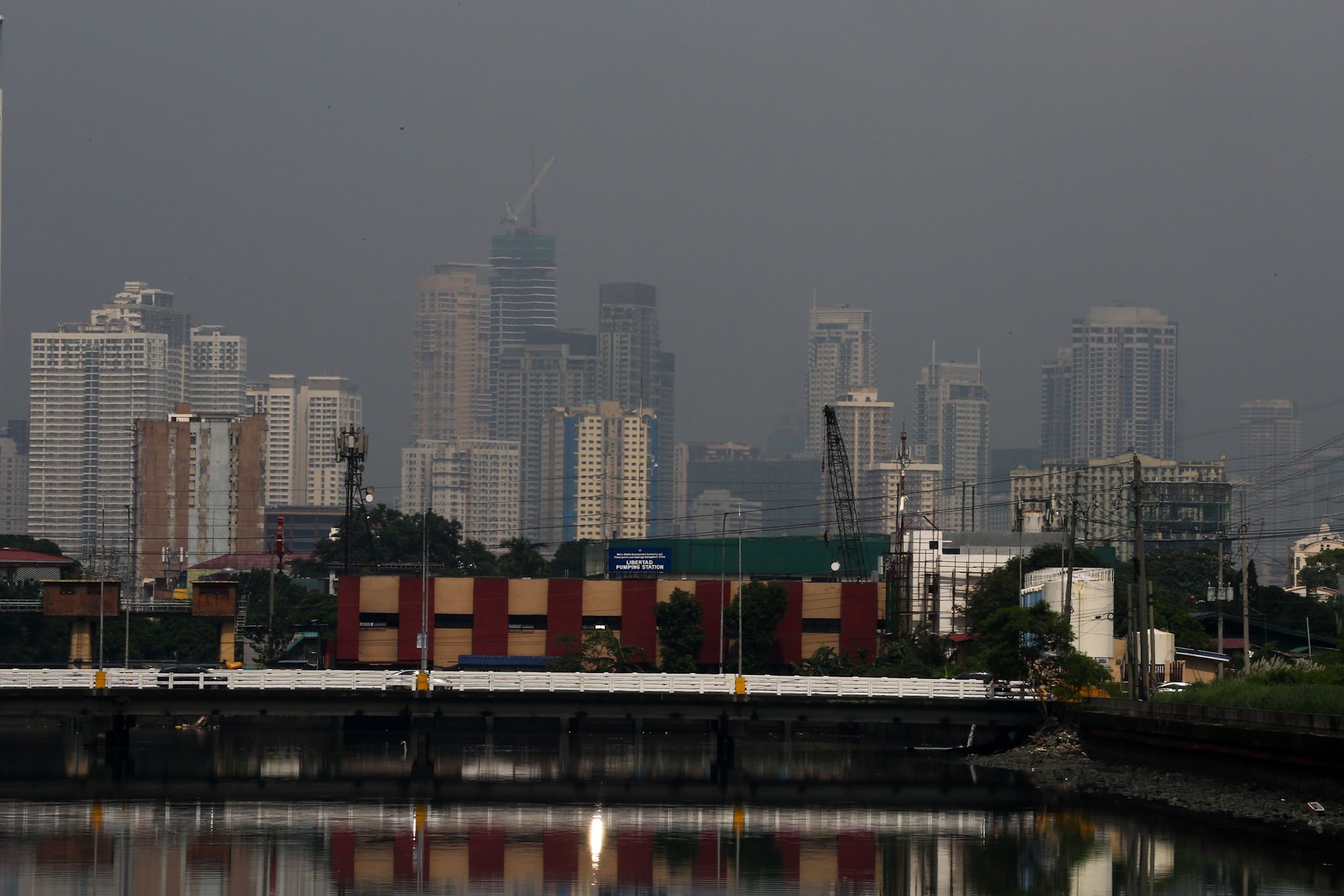 Haze shrouds high-rise buildings in Metro Manila, as seen from JW Diokno Boulevard in Pasay City on 17 September 2026. The Metro Manila air quality index ranged from moderate to unhealthy, according to the IQAir app.