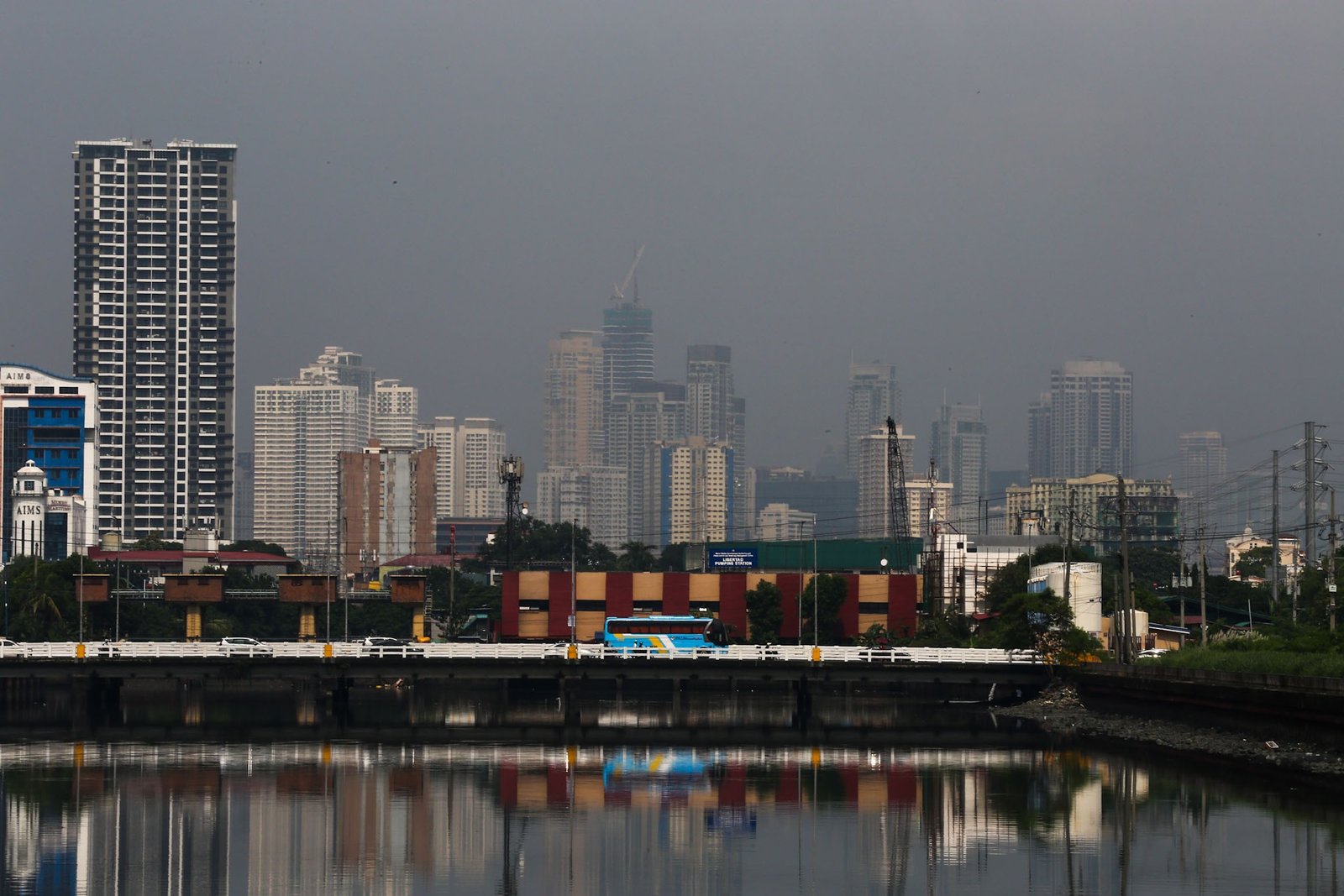 Haze shrouds high-rise buildings in Metro Manila, as seen from JW Diokno Boulevard in Pasay City on 17 September 2026. The Metro Manila air quality index ranged from moderate to unhealthy, according to the IQAir app.