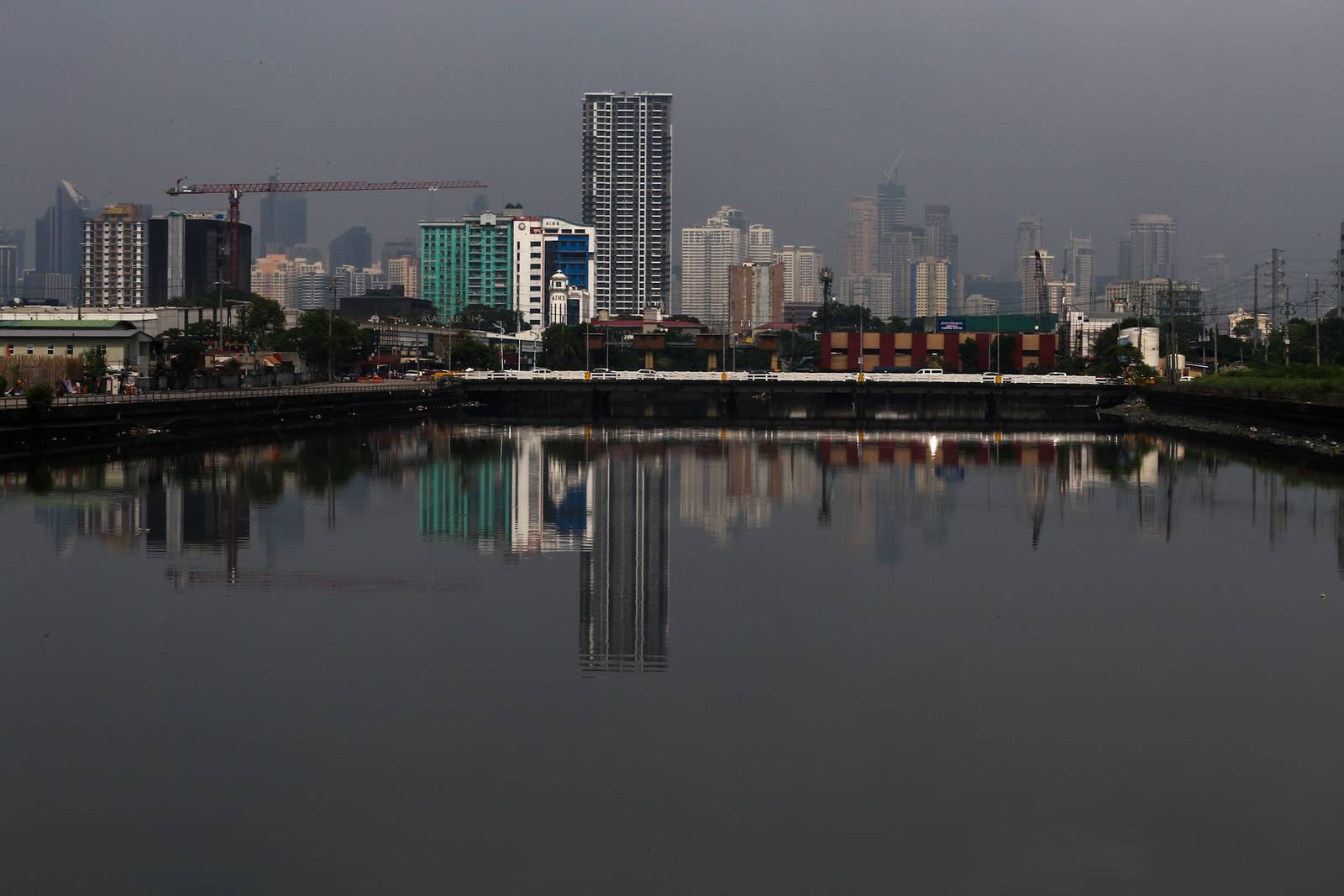 Haze shrouds high-rise buildings in Metro Manila, as seen from JW Diokno Boulevard in Pasay City on 17 September 2026. The Metro Manila air quality index ranged from moderate to unhealthy, according to the IQAir app.