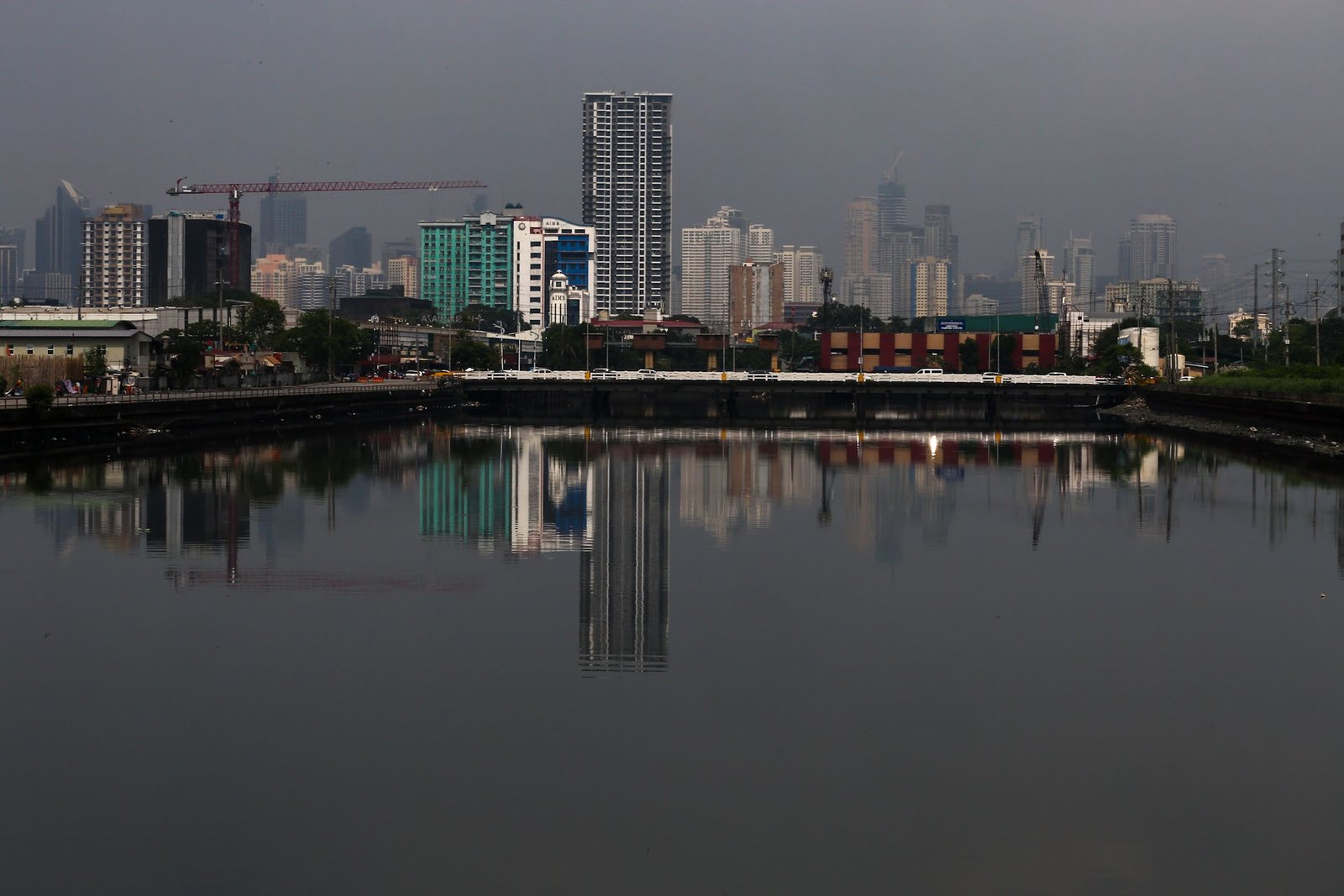 Haze shrouds high-rise buildings in Metro Manila, as seen from JW Diokno Boulevard in Pasay City on 17 September 2026. The Metro Manila air quality index ranged from moderate to unhealthy, according to the IQAir app.