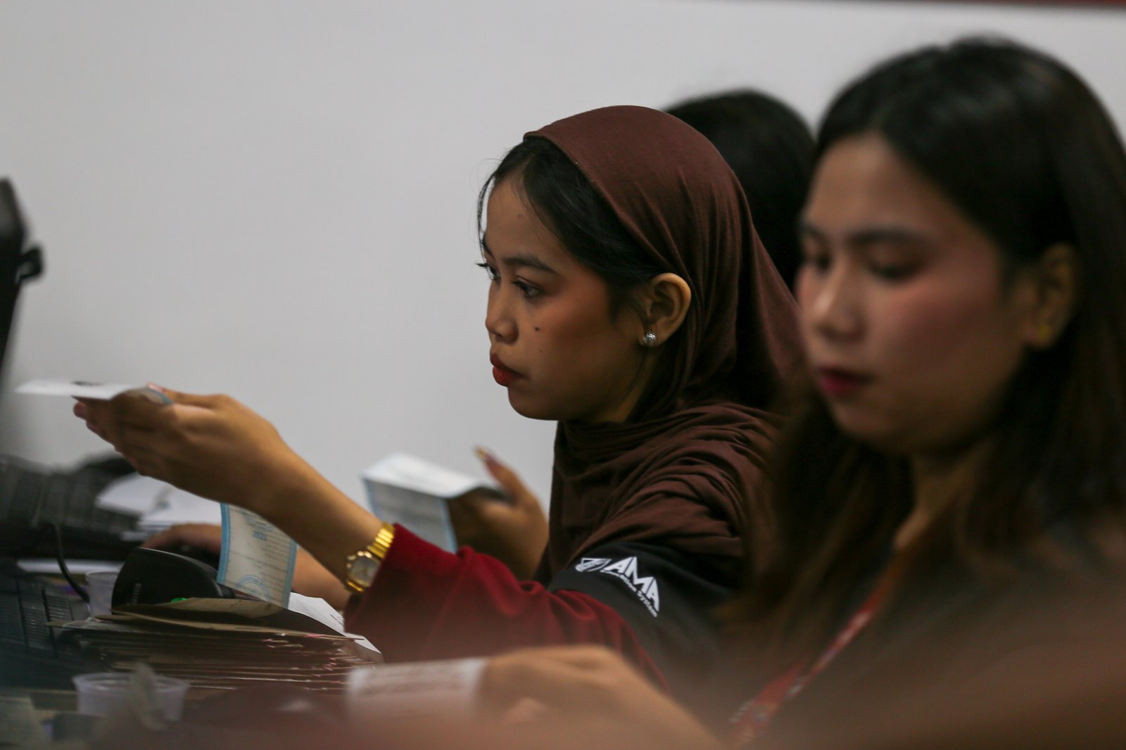 Volunteers scan and verify election returns from various precincts following the September 14 Bangsamoro Parliamentary elections at the PPCRV Command Center in Makati on 18 September 2026. The elected ministers will be replacing the 80-member parliament once the interim parliament ends in October.