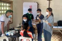 COMMUNITY members undergo free health screenings and receive individual counseling and medicines.