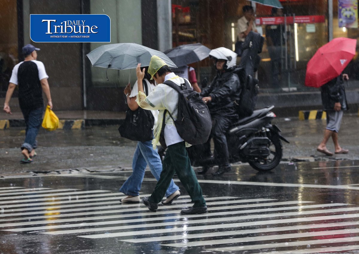 CAUGHT IN THE DOWNPOUR
Pedestrians use umbrellas and other makeshift covers to shield themselves from a sudden heavy downpour along EDSA in Quezon City on Friday, 18 September 2026. | Analy Labor