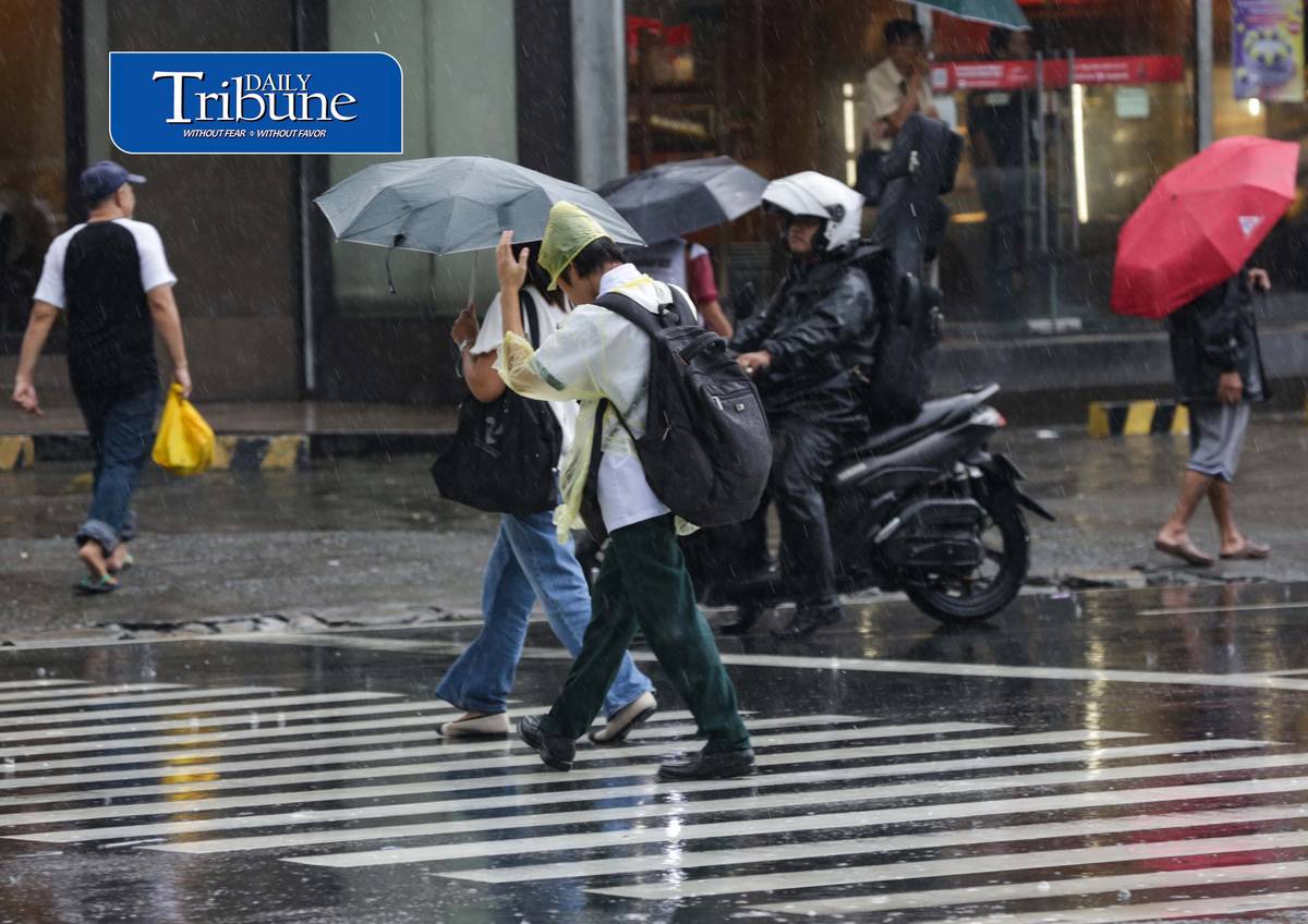 CAUGHT IN THE DOWNPOUR
Pedestrians use umbrellas and other makeshift covers to shield themselves from a sudden heavy downpour along EDSA in Quezon City on Friday, 18 September 2026. | Analy Labor