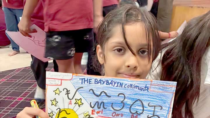 AN Indian schoolgirl holds up her hand-drawn chart of Baybayin consonants after learning the Filipino script at Vega School in Gurgaon, India.