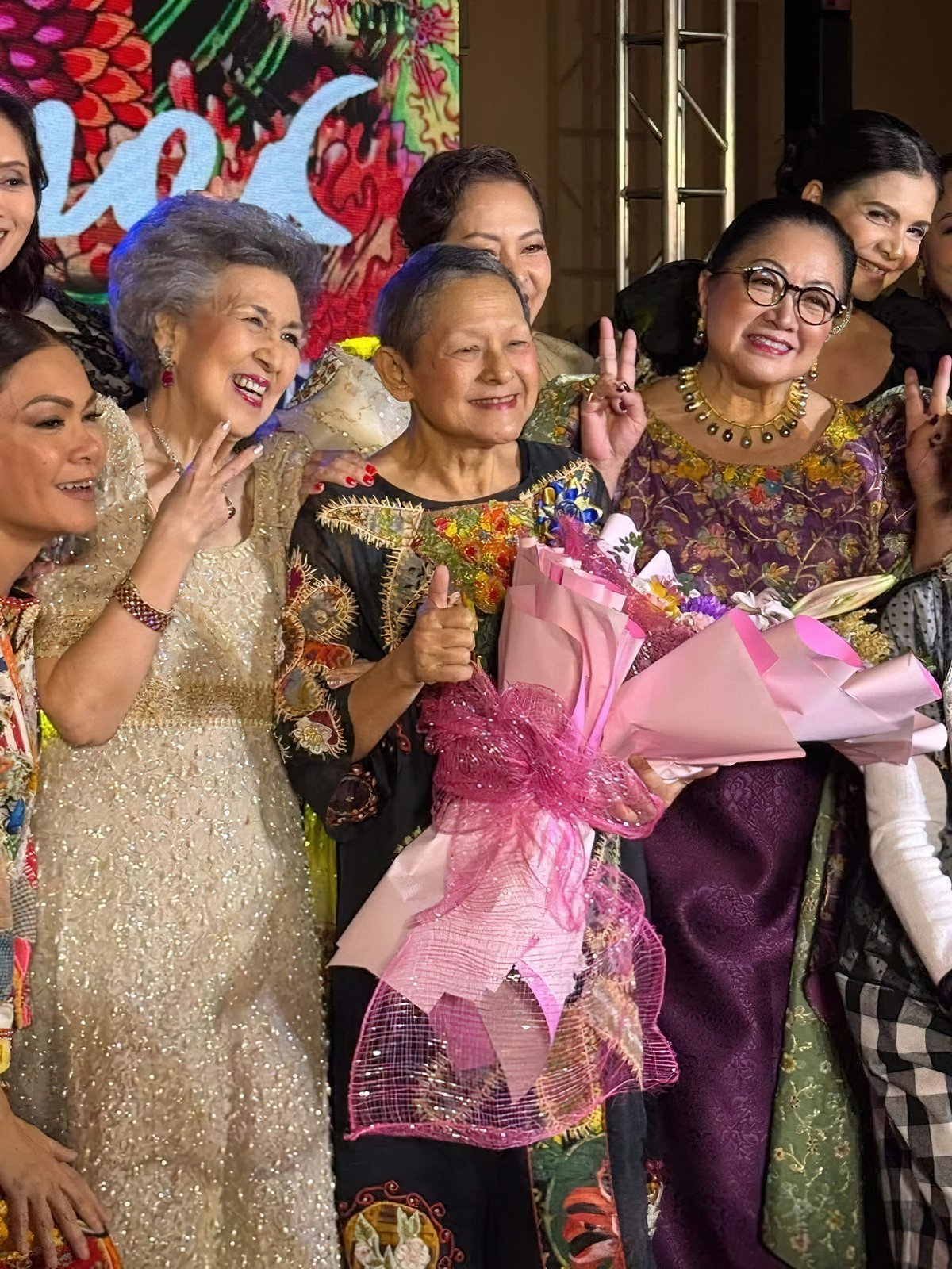 FIRST Maryknoller National Artist for Design Patis Tesoro flanked by celebrated Maryknollers.