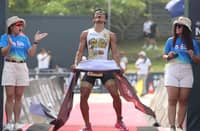 EDGIE Arances celebrates after crossing the finish line to secure the Filipino Elite Category title of the Damosa Land 5150 Triathlon on Sunday in Samal Island, Davao del Norte.