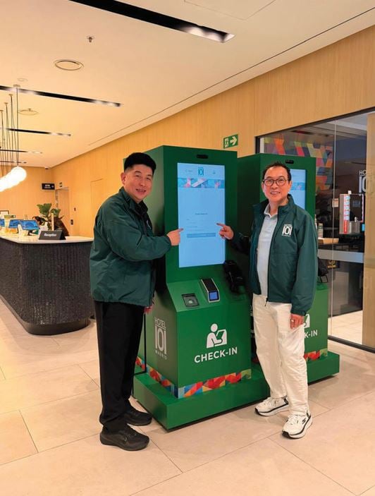 INJAP Sia and Tony Tan Caktiong trying out the self check-in kiosk at Hotel101-Madrid. The kiosks serve to augment the significant daily volume of check-in of hotel guests.