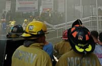 SMOKE rises from the Land Transportation Office-National Capital Region compound along G. Araneta Avenue in Barangay Santo Domingo on Sunday after a fire broke out on the building’s third floor and reached the second alarm.