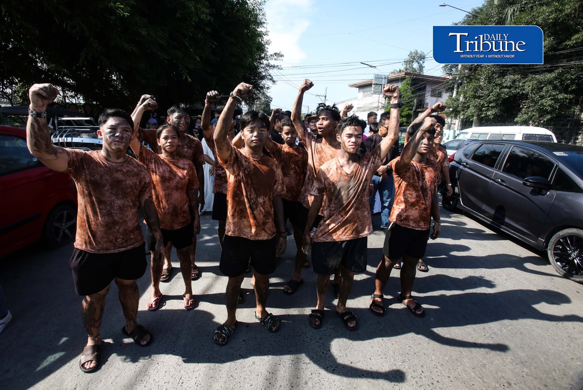 (September 20, 2026) Members of the Tindig Kalumpitenyo group march with a crocodile caricature as a visual expression of anger over the flood-control controversy and to demand accountability during the "Tindig Kalumpitenyo: Black, Mud, and Candles" interfaith prayer rally on Sunday, September 20, 2026. / Analy Labor