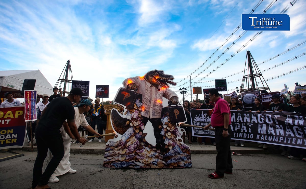 (September 20 2026) Tindig Kalumpitenyo group burn the crocodile caricature as a symbol of their visual expression of anger over the flood-control controversy and the continuing demand for accountability, during the Tindig Kalumpitenyo a Black, Mud, and Candles. interfaith prayer rally, on Sunday September 20 2026/Analy Labor