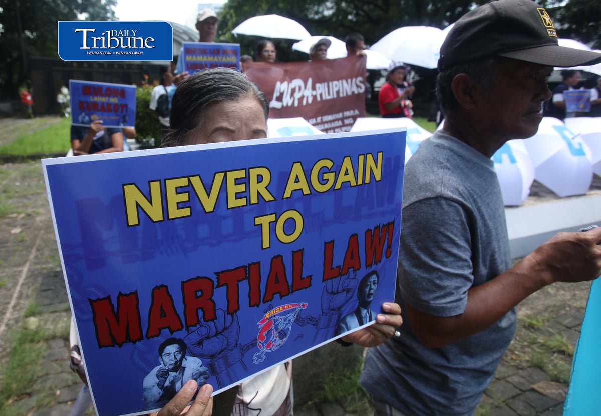(September 21 2026) In observance of International Day of Peace, a global holiday observed every year on September 21 to commit to peace and stop all violence, and also 54th anniversary of the declaration of Martial Law. Members of Kilusan para sa Pambansang Demokrasya and World BEYOND War Asia hold dozens of white umbrellas symbolizing their call for peace, opposition to Pax Silica, rejection of US-Philippine military agreements, support for a Free Palestine, peace in Myanmar, and the call for “US Out of Asia” during a protest action dubbed PEACE Umbrellas: Shield to Continuous Rain of War and Militarism, at the Bantayog ng mga Bayani in Quezon City on Monday, September 21, 2026. Photo/Analy Labor