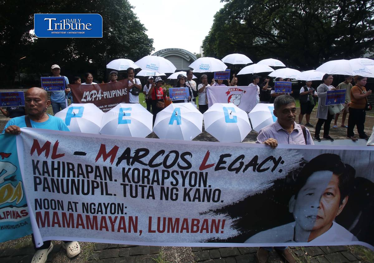 (September 21 2026) In observance of International Day of Peace, a global holiday observed every year on September 21 to commit to peace and stop all violence, and also 54th anniversary of the declaration of Martial Law. Members of Kilusan para sa Pambansang Demokrasya and World BEYOND War Asia hold dozens of white umbrellas symbolizing their call for peace, opposition to Pax Silica, rejection of US-Philippine military agreements, support for a Free Palestine, peace in Myanmar, and the call for “US Out of Asia” during a protest action dubbed PEACE Umbrellas: Shield to Continuous Rain of War and Militarism, at the Bantayog ng mga Bayani in Quezon City on Monday, September 21, 2026. Photo/Analy Labor