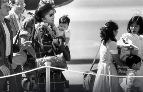 The Marcoses fleeing the Palace.