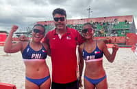 Khylem Progella (left) and Sofiah Pagara (right) get a pat on the back from national coach Joao Luciano Kioday after beating Tsolmon Batjargal and Khandsuren Gantogtokh of Mongolia, 21-3, 21-3, to stay perfect in the women’s beach volleyball event of the 20th Asian Games.