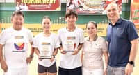 KATHLYN Bugna (second from left) beams as she poses with (from left) coach Ronald Martin, fellow MVP Krelz Gecosala, and Lia and Erwin Garcia of A.C. Garcia Group of Companies after winning three titles in the Bagong Pilipinas Juniors Age Group Tennis Championships.