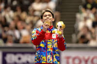 FLEXING gold Carlos Yulo shows off his gold medal during the awarding ceremony for the men’s floor exercise at the 2026 Asian Games — another golden moment for the Philippines’ gymnastics ace.
