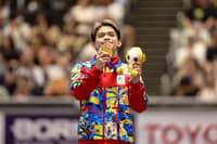 FLEXING gold Carlos Yulo shows off his gold medal during the awarding ceremony for the men’s floor exercise at the 2026 Asian Games — another golden moment for the Philippines’ gymnastics ace.