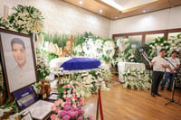 Marcos pays final respects to Cua