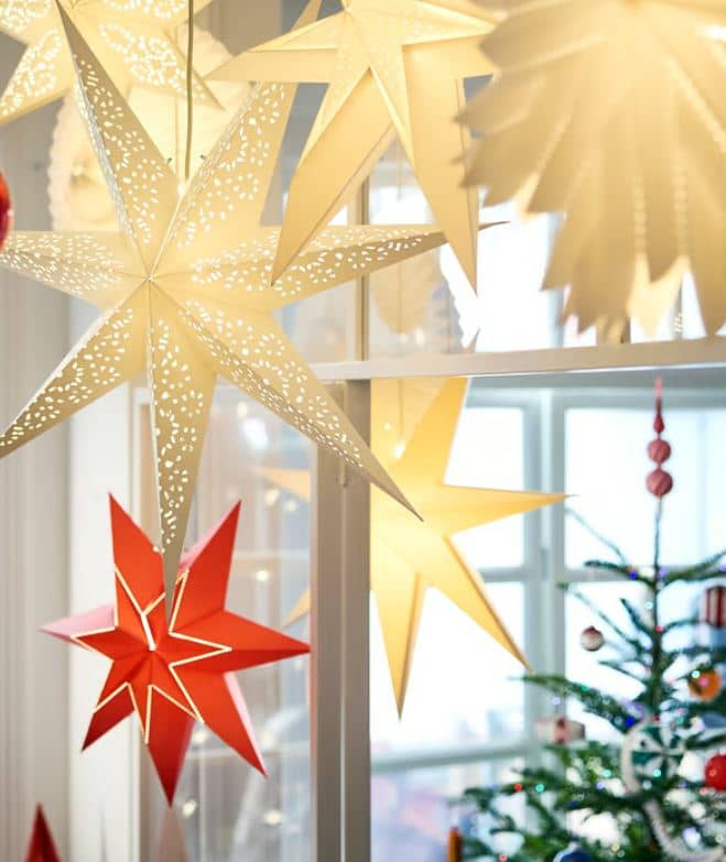 Warm lighting, ornaments and greenery can create a cozy holiday atmosphere at home.