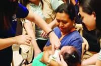 A HEALTH worker administers a measles-rubella vaccine to a child at a center in Roxas City as part of the 2026 Measles-Rubella Supplemental Immunization activity.