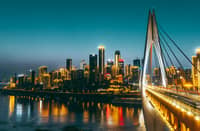 ROADS, bridges and buildings overlap across Chongqing’s steep terrain, creating a distinctly three-dimensional cityscape.