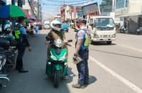 PERSONNEL from the Cebu City Police Office conduct traffic enforcement along Magallanes St. in Cebu City. A transport group has announced plans to join a nationwide transport strike in Cebu on 29 September to protest rising fuel and commodity prices.