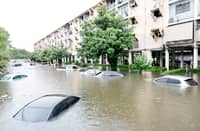 FLOOD waters submerge cars next to residential buildings after heavy rain in Bangkok on 26 September 2026.