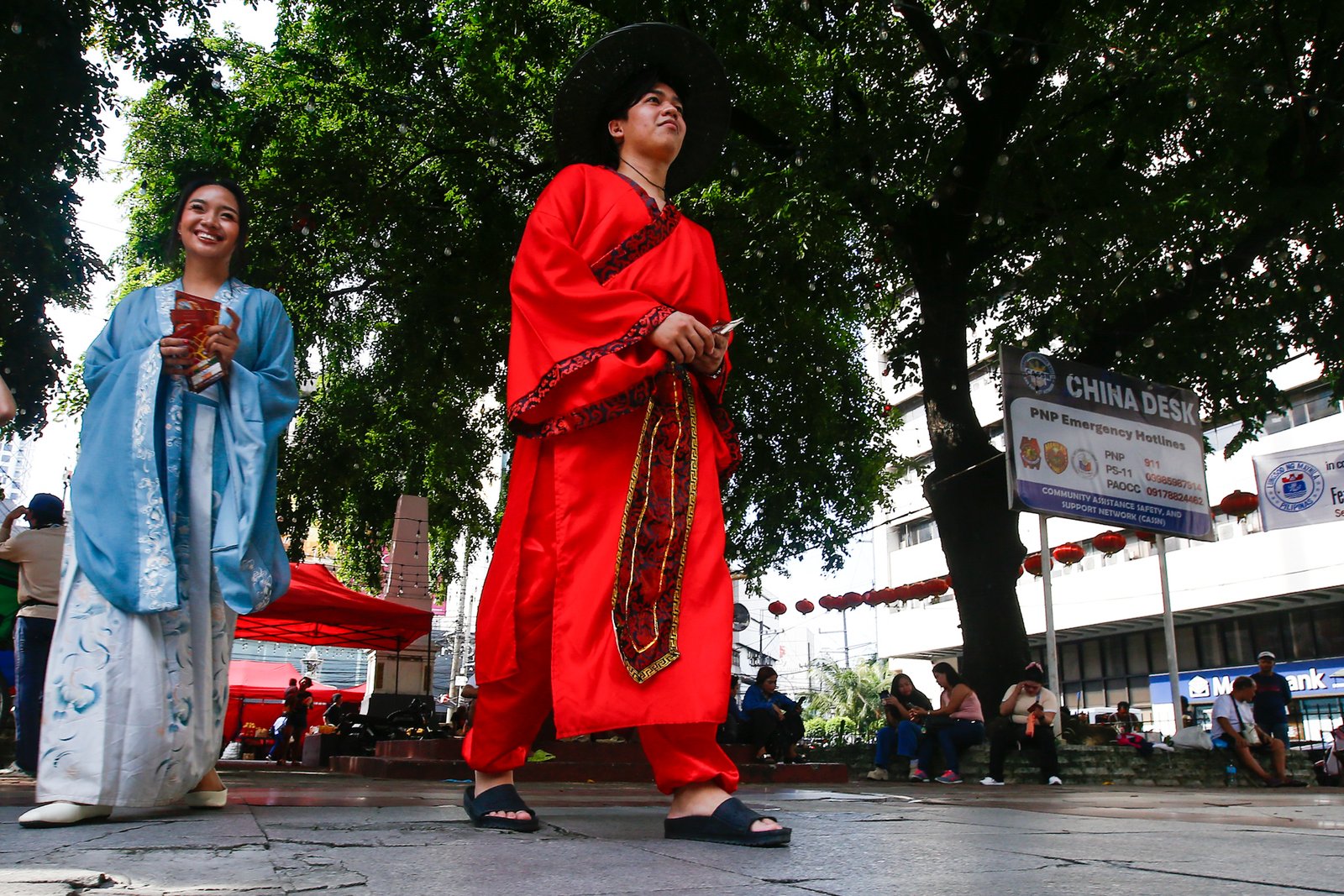 Dressed in traditional Chinese costumes, Hairo Oliquino and Janelle Buesing roam around Plaza Calderon dela Barca in Binondo, Manila, on 26 September 2026, to promote the latest food destination in Chinatown. Binondo is known for its vibrant Chinese food culture and diverse culinary offerings.