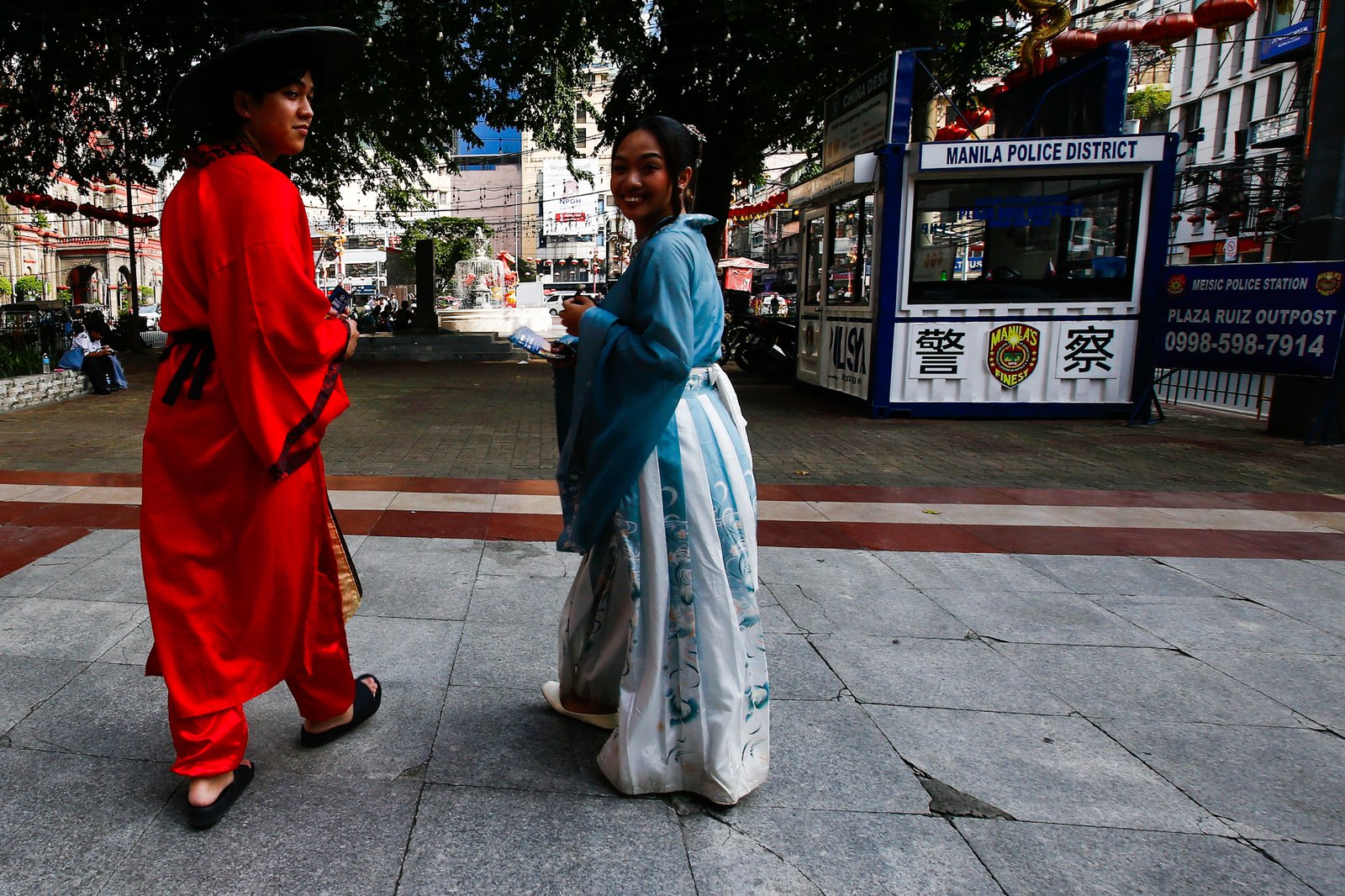 Dressed in traditional Chinese costumes, Hairo Oliquino and Janelle Buesing roam around Plaza Calderon dela Barca in Binondo, Manila, on 26 September 2026, to promote the latest food destination in Chinatown. Binondo is known for its vibrant Chinese food culture and diverse culinary offerings.